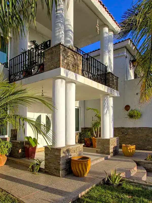 twilight courtyard palm trees pool