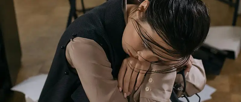 woman resting on top of hands