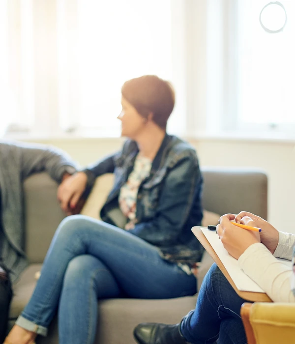 twilight group therapy woman sitting couch note pad