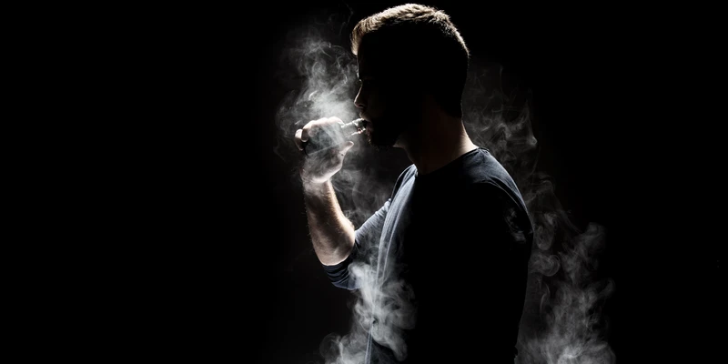 twilight marijuana man smoking cigarette dark