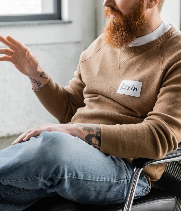 twilight therapy man beard brown sweater sits chair