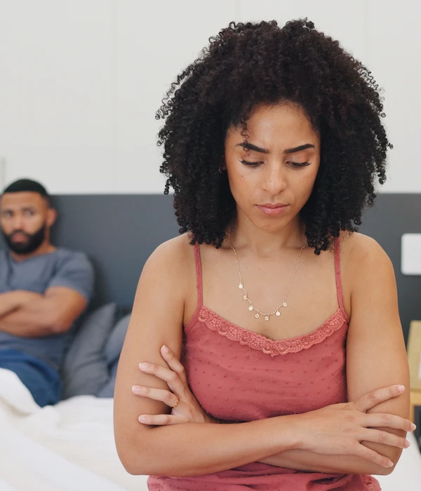 twilight woman pink top sitting bed arms crossed sex