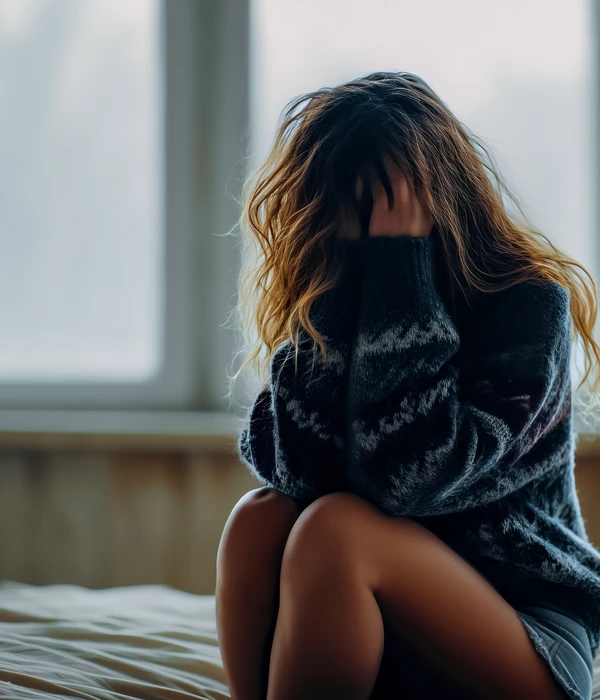 twilight woman sitting bed head hands sex porn addiction